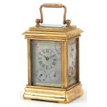 Miniature brass cased carriage clock with Sevres type porcelain panels decorated with Putti, 8cm