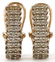 Pair of 9ct gold diamond three row half hoop earrings, each 1.7cm high, total 3.0g