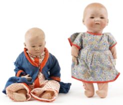 Armand Marseille bisque headed boy doll together with a bisque headed baby doll, the largest 30cm in