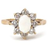 9ct gold cabochon opal and clear stone flower head ring, size M, 2.2g