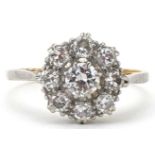 18ct gold and platinum diamond cluster ring, the central diamond approximately 0.32 carat, each