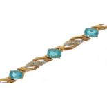 9ct gold blue topaz and diamond line bracelet, 19cm in length, 7.4g