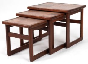 Nest of three tile top teak occasional tables, the largest 43cm H x 55cm W x 44.5cm D