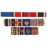 Three British military medal bars including Mentioned in despatches, the largest 10cm in length