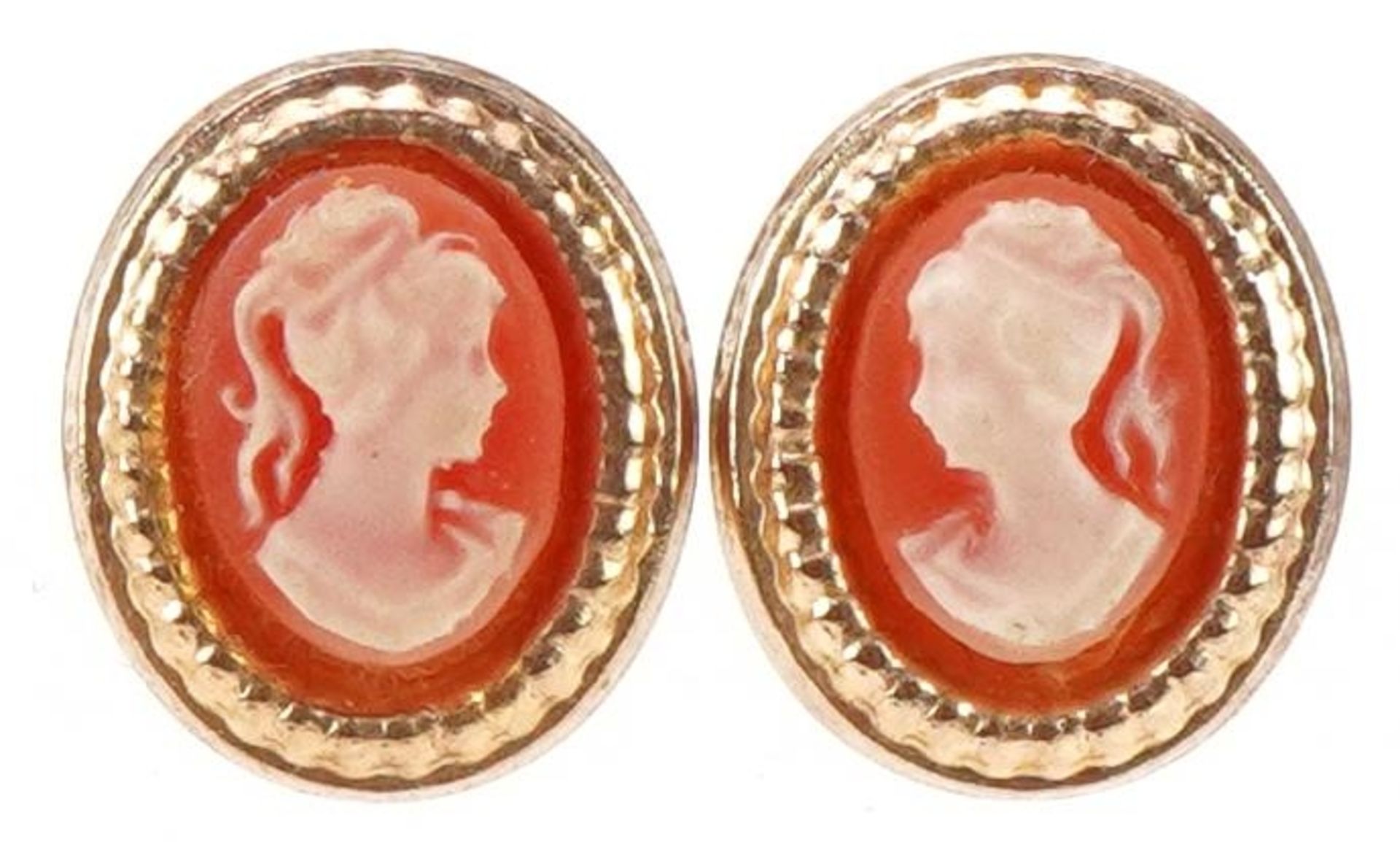 Pair of yellow metal cameo style stud earrings decorated with maiden heads, each 11.5mm high,