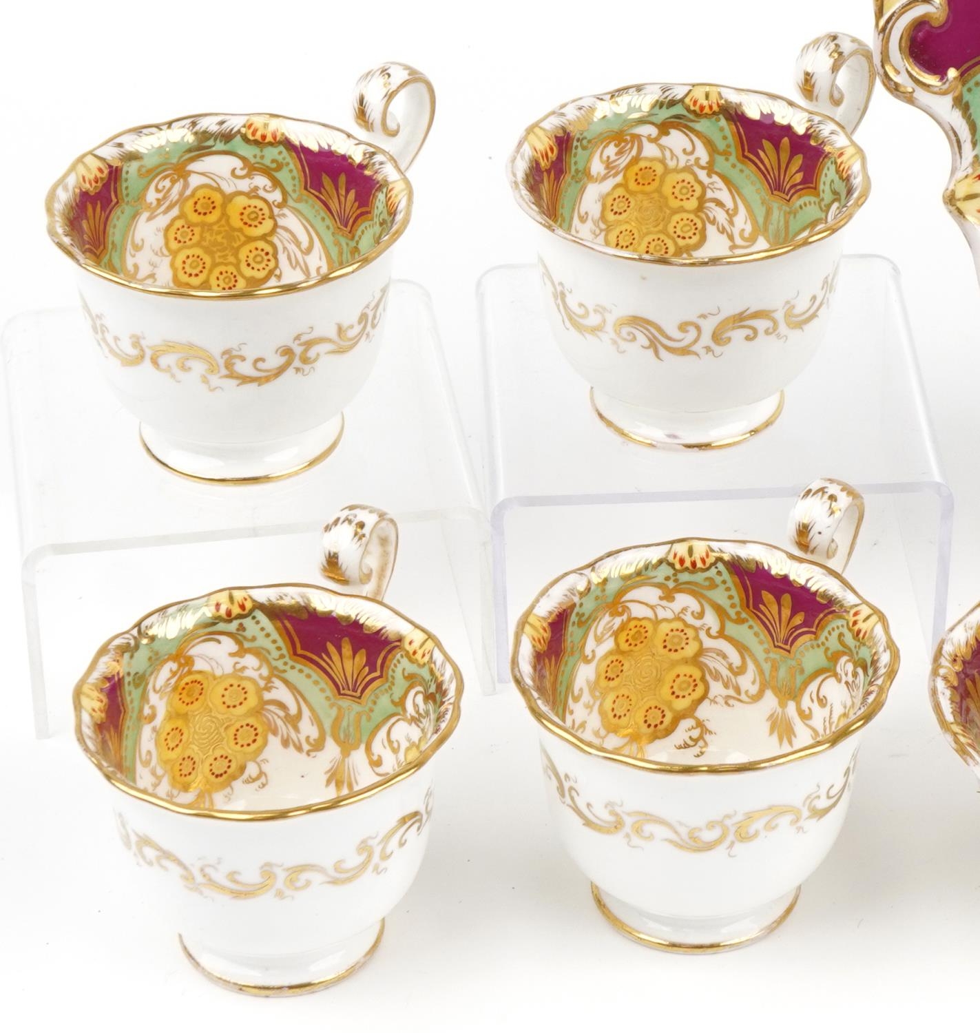 Victorian teaware hand painted and gilded with flowers, seven cups, slop bowl and side plate, the - Image 2 of 4