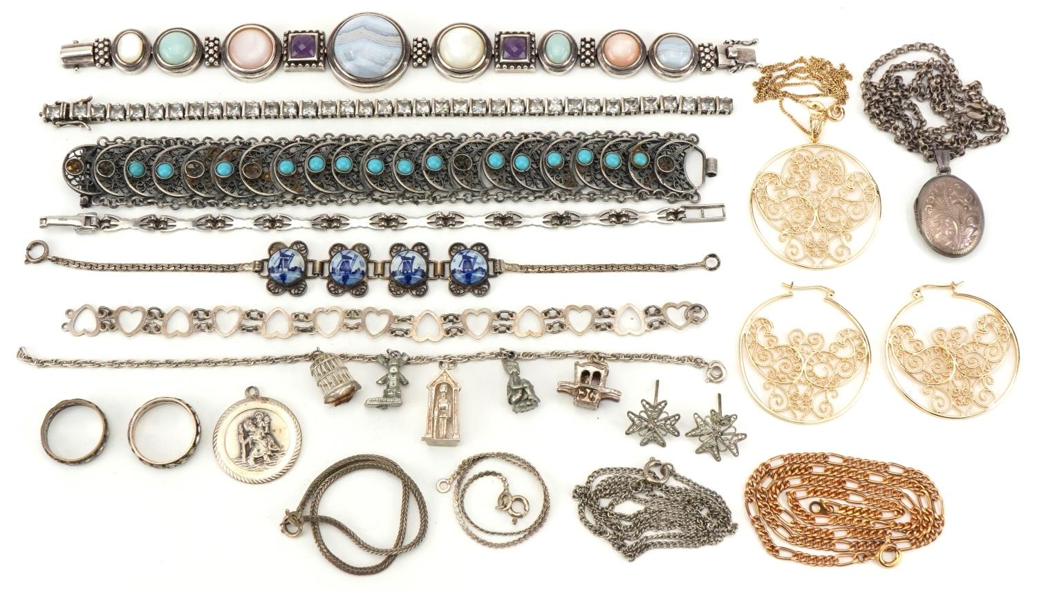 Vintage and later silver and white metal jewellery including a charm bracelet, floral engraved
