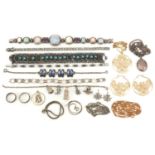 Vintage and later silver and white metal jewellery including a charm bracelet, floral engraved