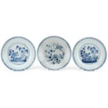 Three 18th century hand painted blue and white plates, two in the Willow pattern, one with
