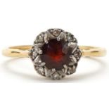 18ct gold garnet and diamond cluster ring, size M, 2.8g