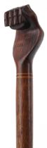 Hardwood Pitcairn Islands clenched fist walking stick, 94cm in length