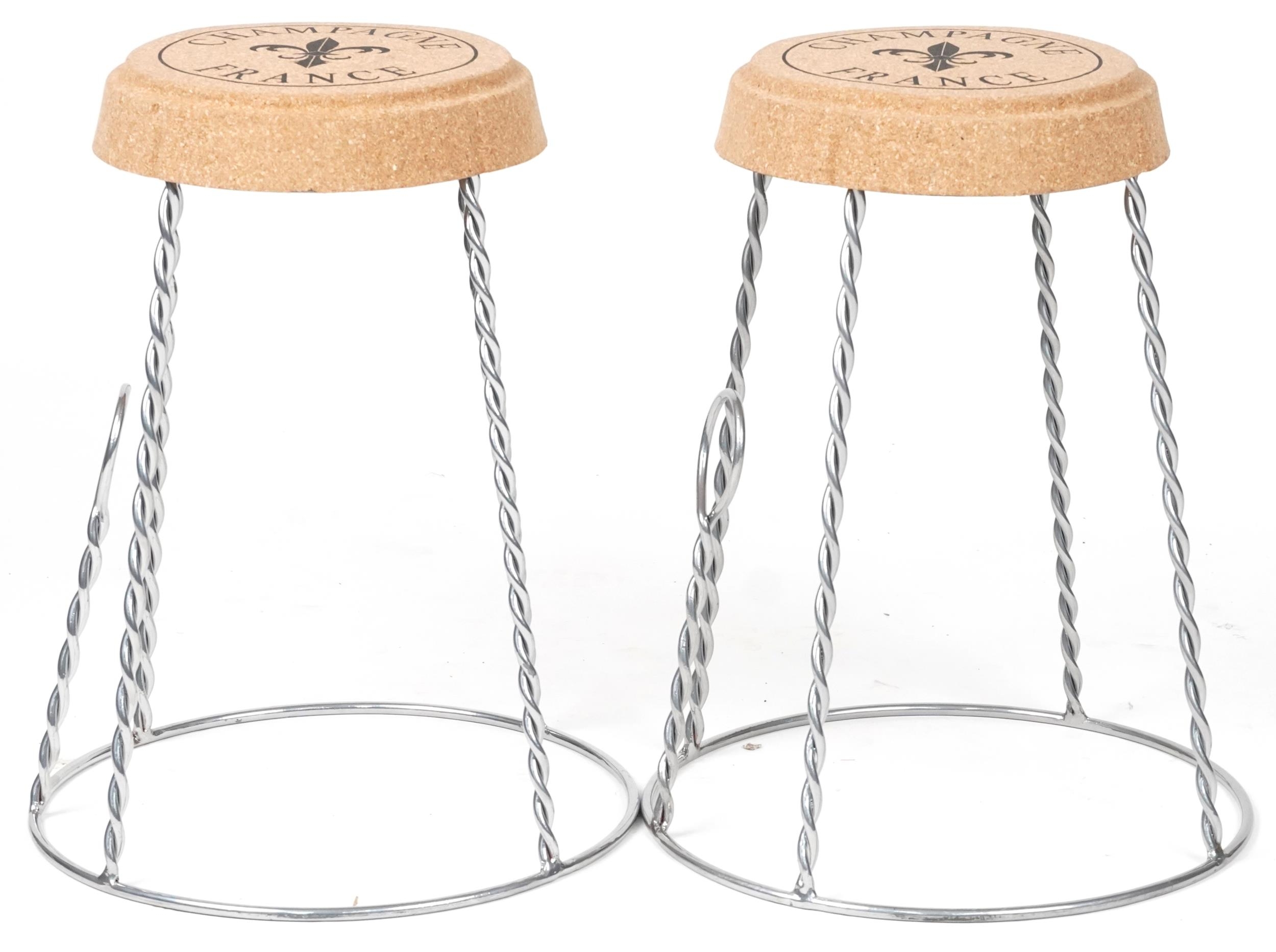 Pair of Champagne cork design stools, each 52cm high