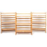 Three folding lightwood three shelf bookcases, each 91cm H x 72cm W x 29.5cm D