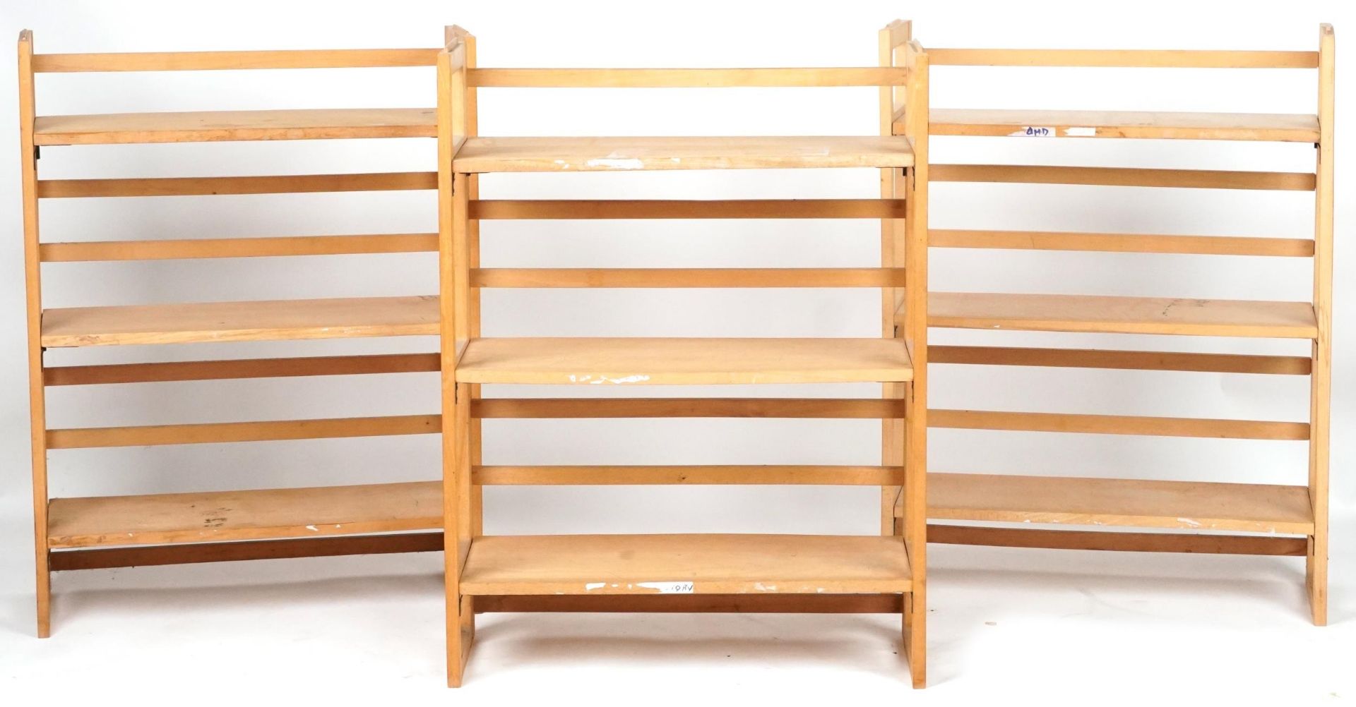 Three folding lightwood three shelf bookcases, each 91cm H x 72cm W x 29.5cm D