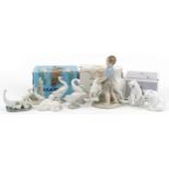 Nine Lladro and Nao figures, animals and groups including two polar bears and a boy with ram, the