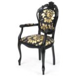 French style black painted elbow chair with black and gold floral upholstery, 103cm high