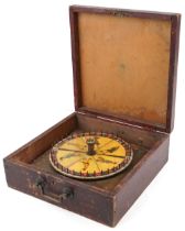 Vintage French novelty Roulette style wheel game with worldly figures, housed in a painted pine case