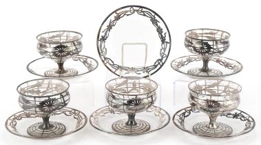 Early 20th century five American silver overlaid glass sundae dishes and saucers, the largest each