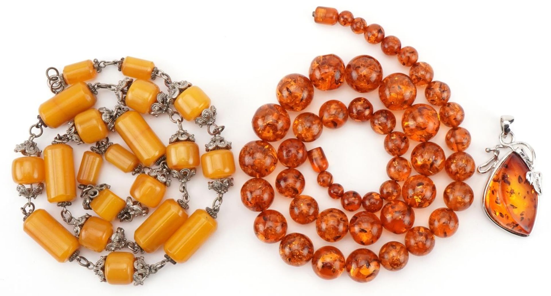 Natural amber bead necklace, pendant and an amber coloured necklace with white metal mounts, total