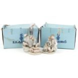 Two Lladro figure groups with boxes comprising Figurine Precocious 4856 and girl with piglets