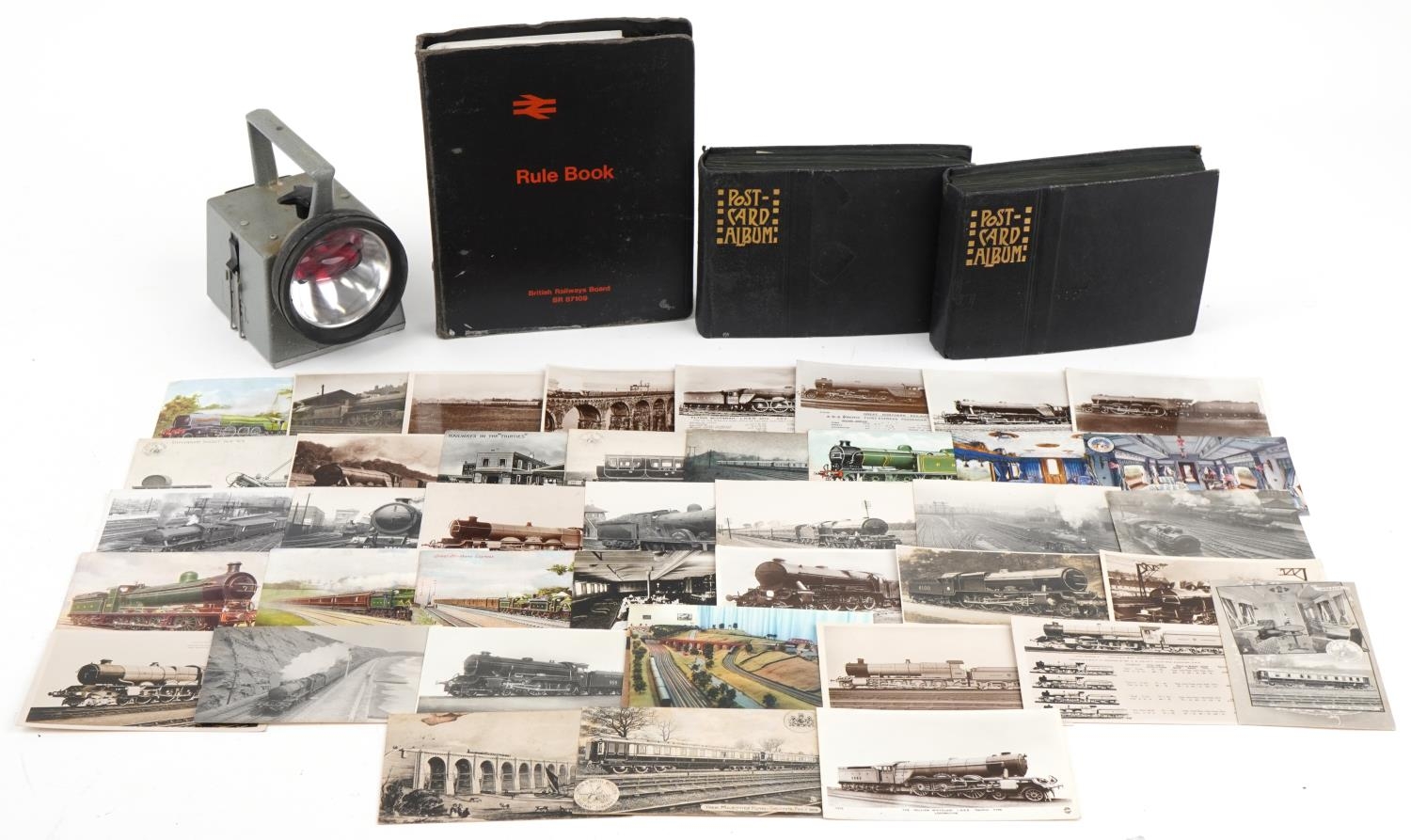 Railway items including postcards of trains arranged in two albums, British Railways torch and a
