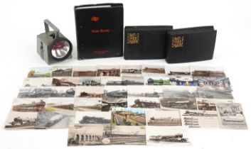 Railway items including postcards of trains arranged in two albums, British Railways torch and a