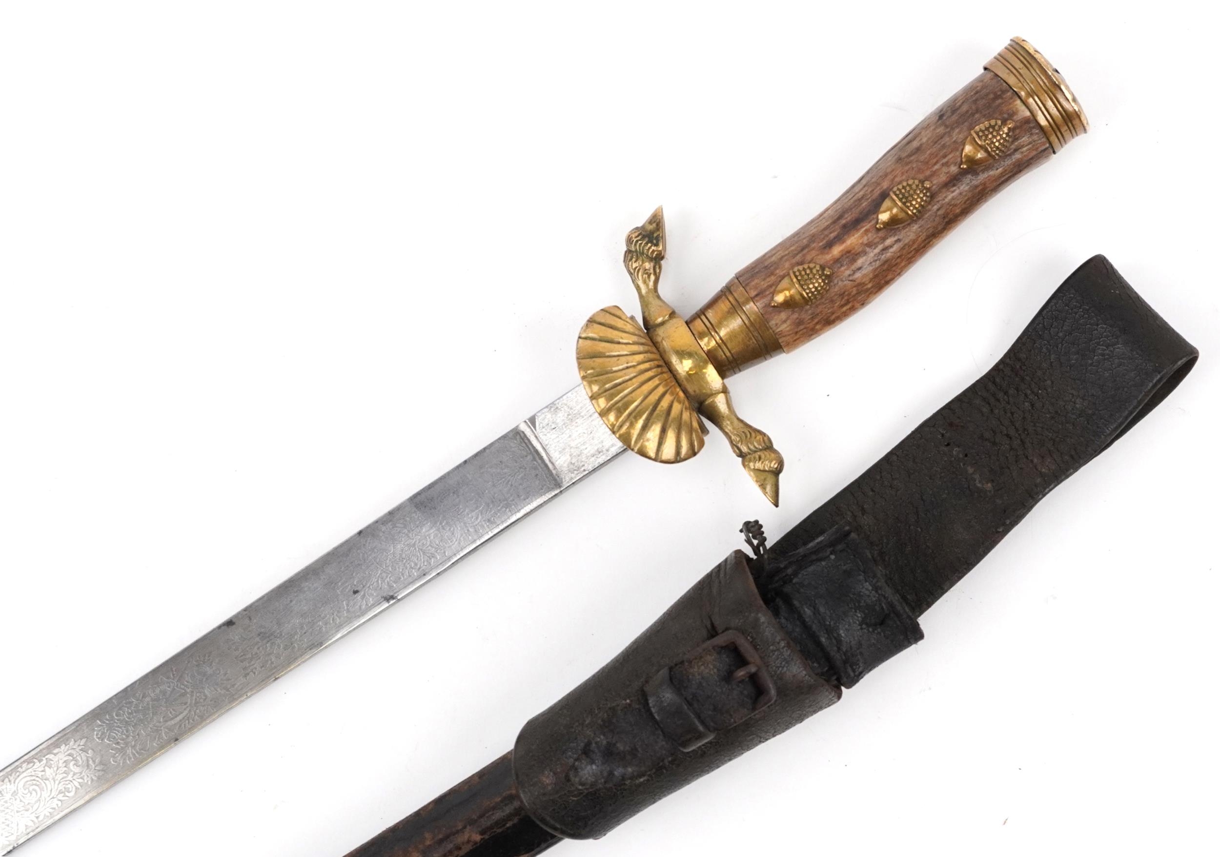 German military interest hunting knife with leather scabbard, staghorn handle and steel blade having
