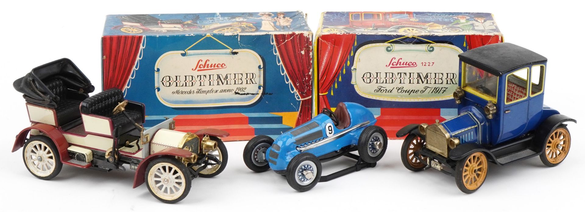 There Schuco tinplate clockwork vehicles, two with boxes, including Ford Coupe and Mercedes Simplex