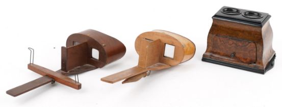 Edwardian walnut stereoscopic viewer together with two wooden stereoscopic viewers, the largest 30cm