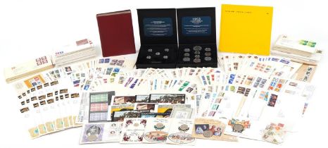 Extensive collection of stamps and coinage including stamps arranged in an album, Canadian first day