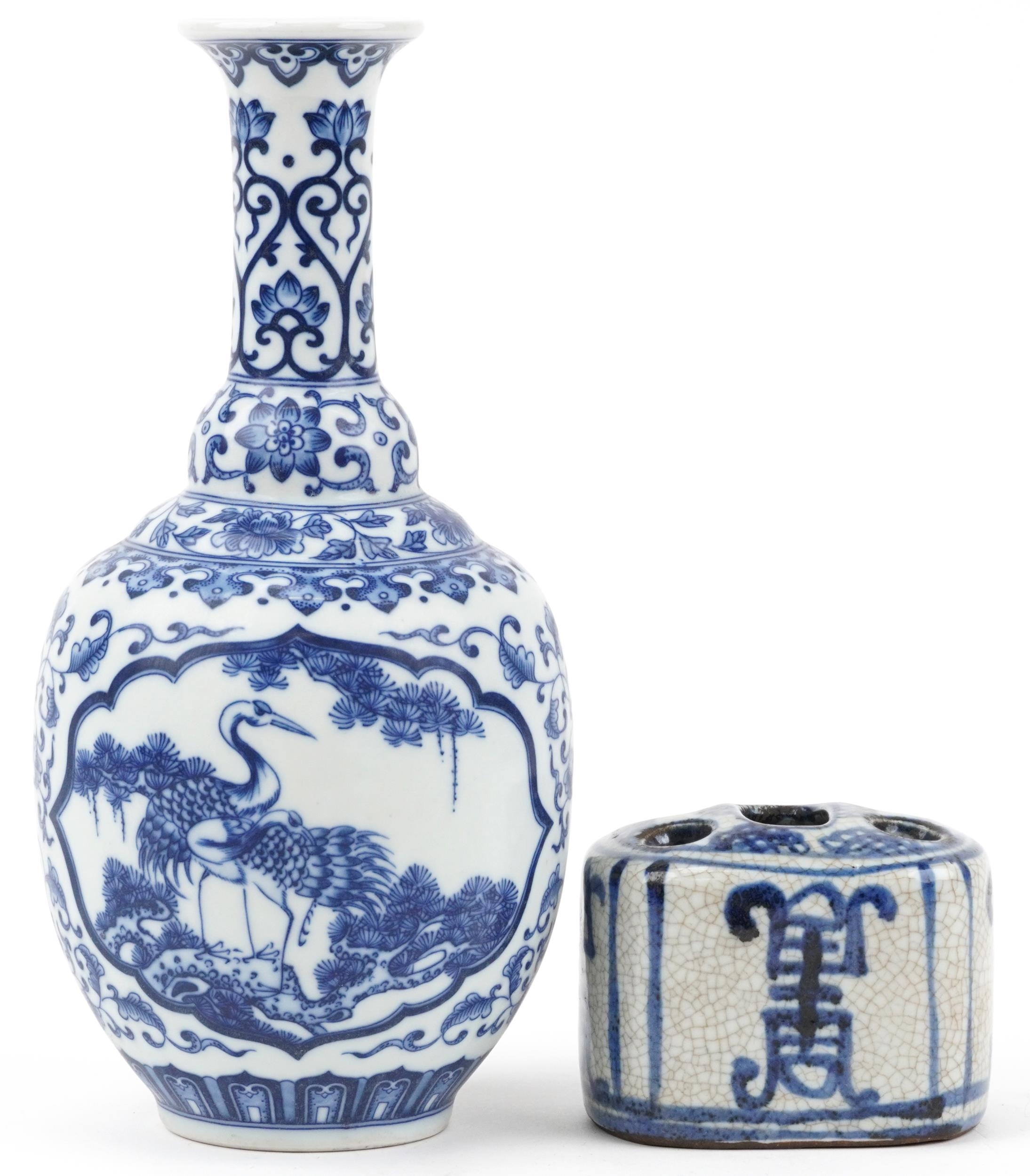 Chinese blue and white porcelain vase decorated with birds of paradise and a five section flower