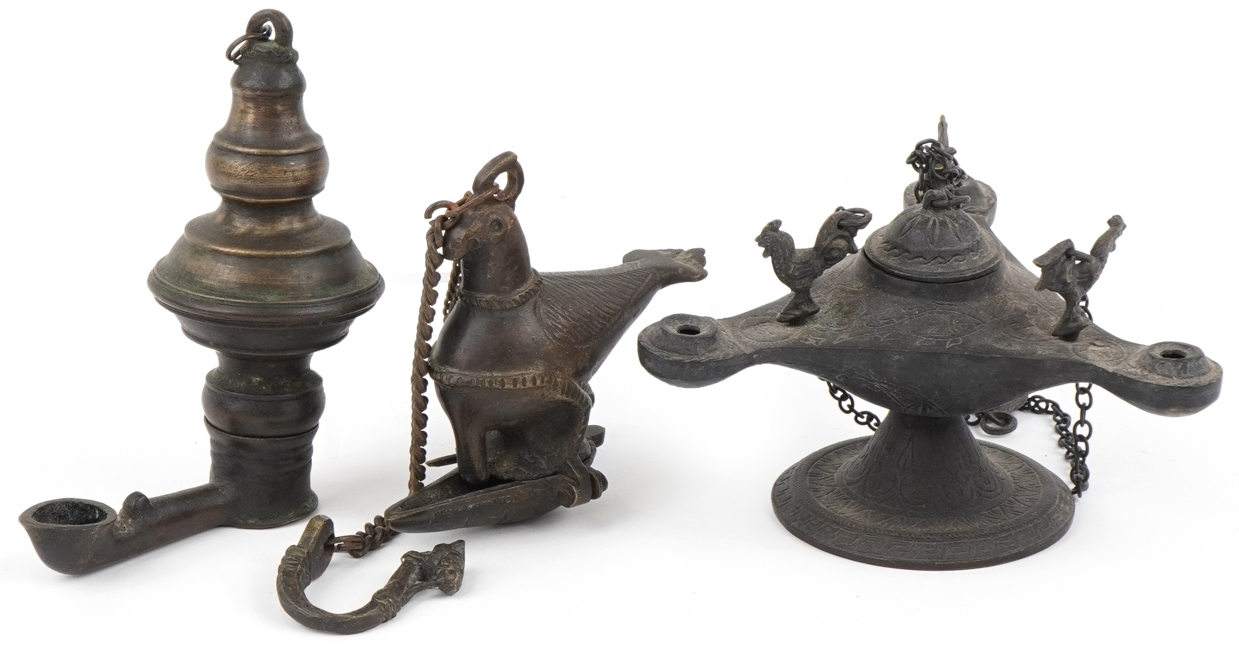 Two antique Indian bronzed hanging oil lamps, one in the form of a mythical bird and a Byzantine