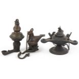Two antique Indian bronzed hanging oil lamps, one in the form of a mythical bird and a Byzantine