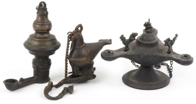 Two antique Indian bronzed hanging oil lamps, one in the form of a mythical bird and a Byzantine