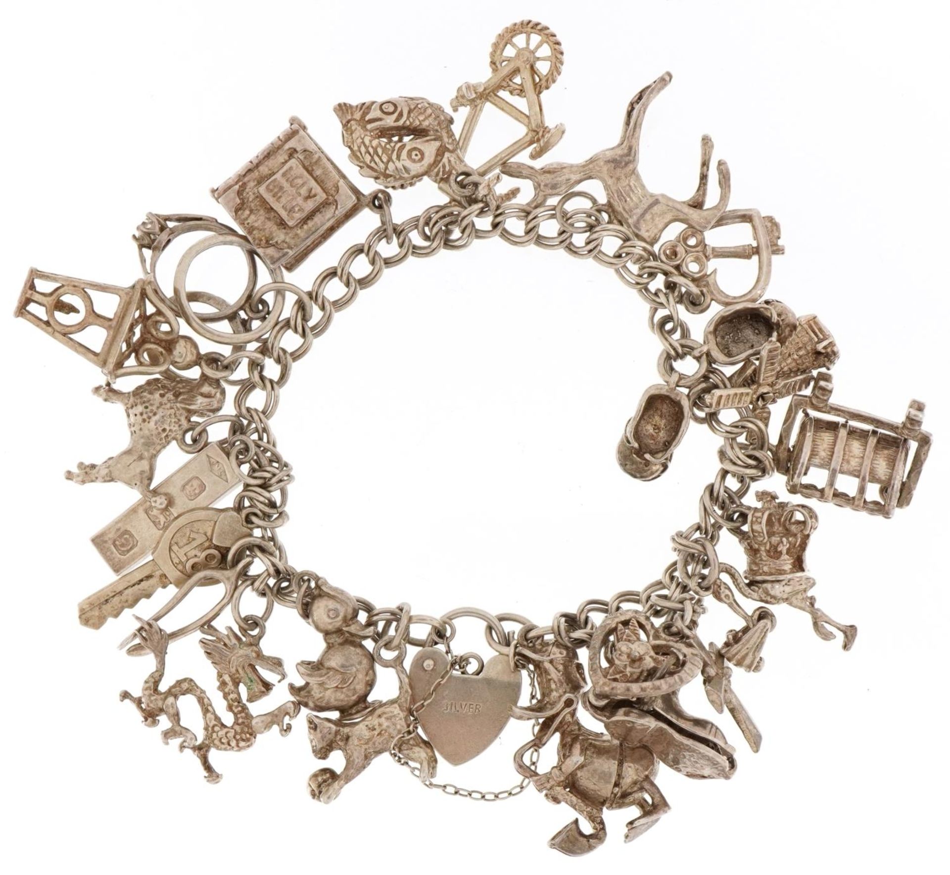 Silver charm bracelet with a large collection of mostly silver charms, 66.6g - Image 2 of 3