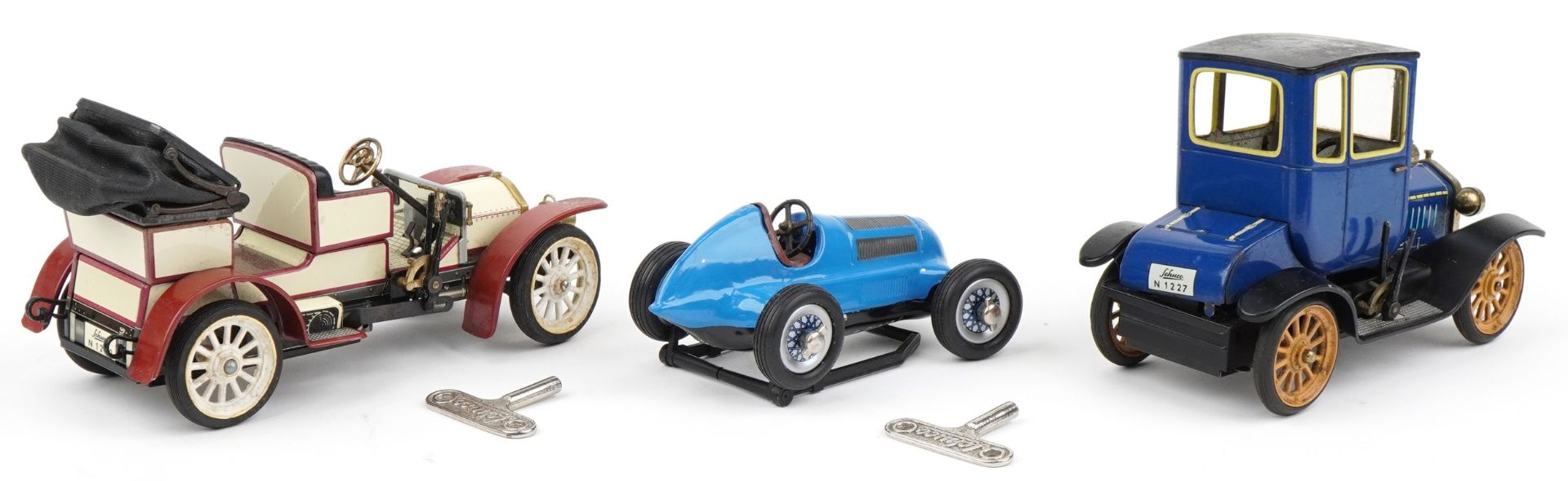 There Schuco tinplate clockwork vehicles, two with boxes, including Ford Coupe and Mercedes Simplex - Bild 3 aus 4