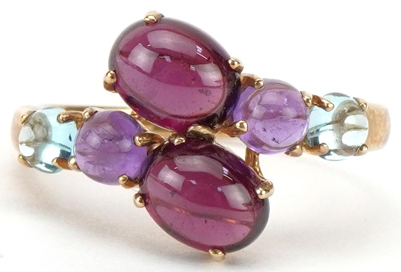 9ct gold multi gem crossover ring set with garnets, amethysts and aquamarine, size T, 3.2g