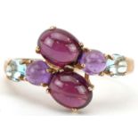 9ct gold multi gem crossover ring set with garnets, amethysts and aquamarine, size T, 3.2g