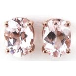 Pair of 9ct rose gold pink stone stud earrings, each 7mm high, total 1.1g