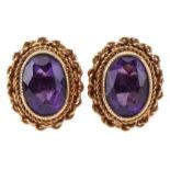 Pair of 9ct gold amethyst stud earrings, each 1.1cm high, total 2.0g