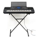 Yamaha PSR-6000 electric keyboard with stand and protective bag