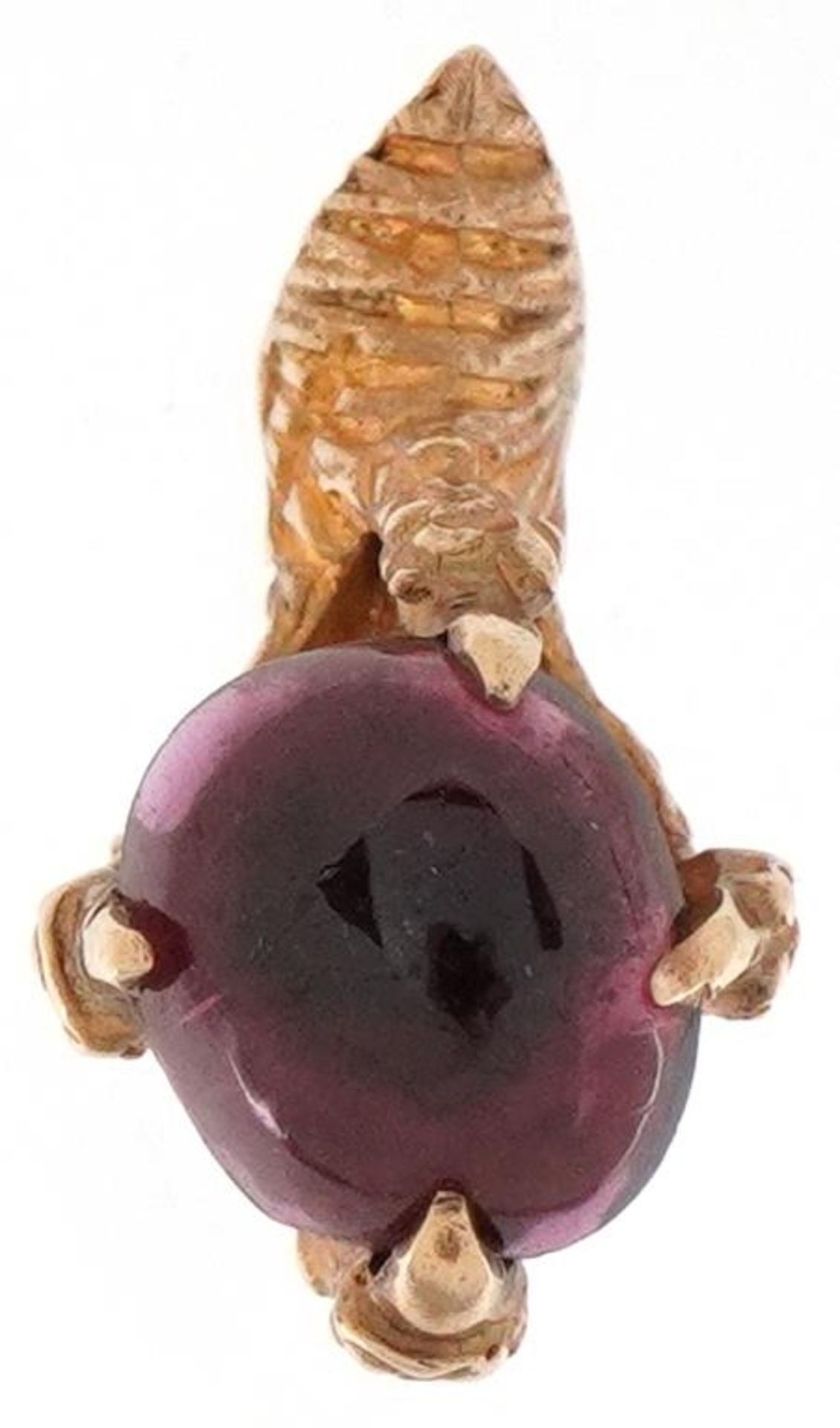 9ct gold charm in the form of dragon claw holding a cabochon garnet, 2.1cm high, 3.4g