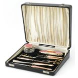 Davis Moss & Co, Art Deco silver gilt and pink guilloche enamel manicure/vanity set housed in a