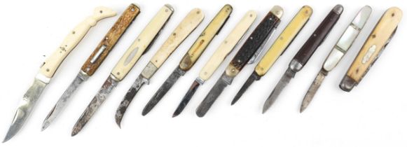 Eleven knives folding pocket knives, some with bone handles