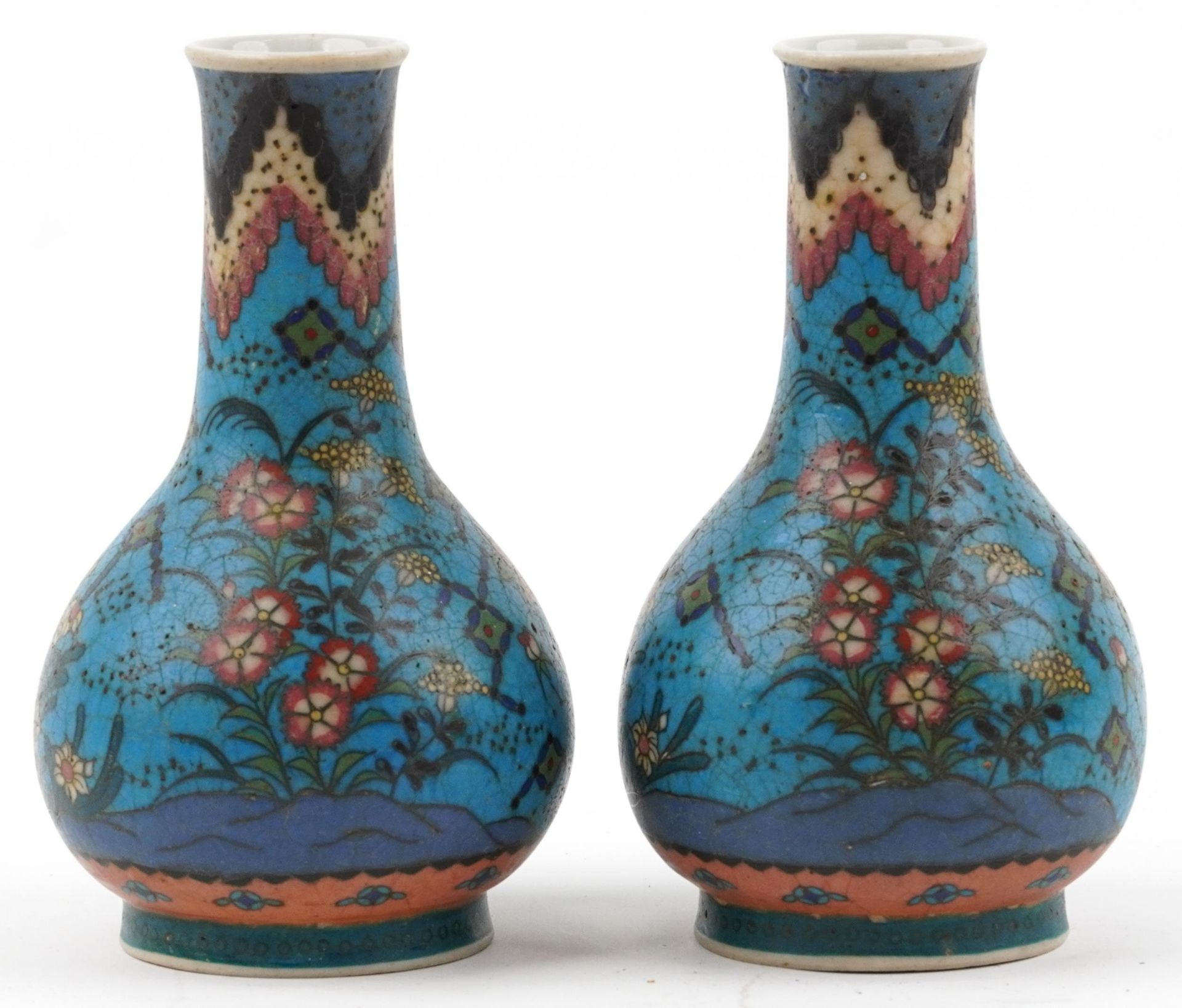 Pair of Japanese Owari shippo porcelain vases enamelled with flowers, each 19cm high