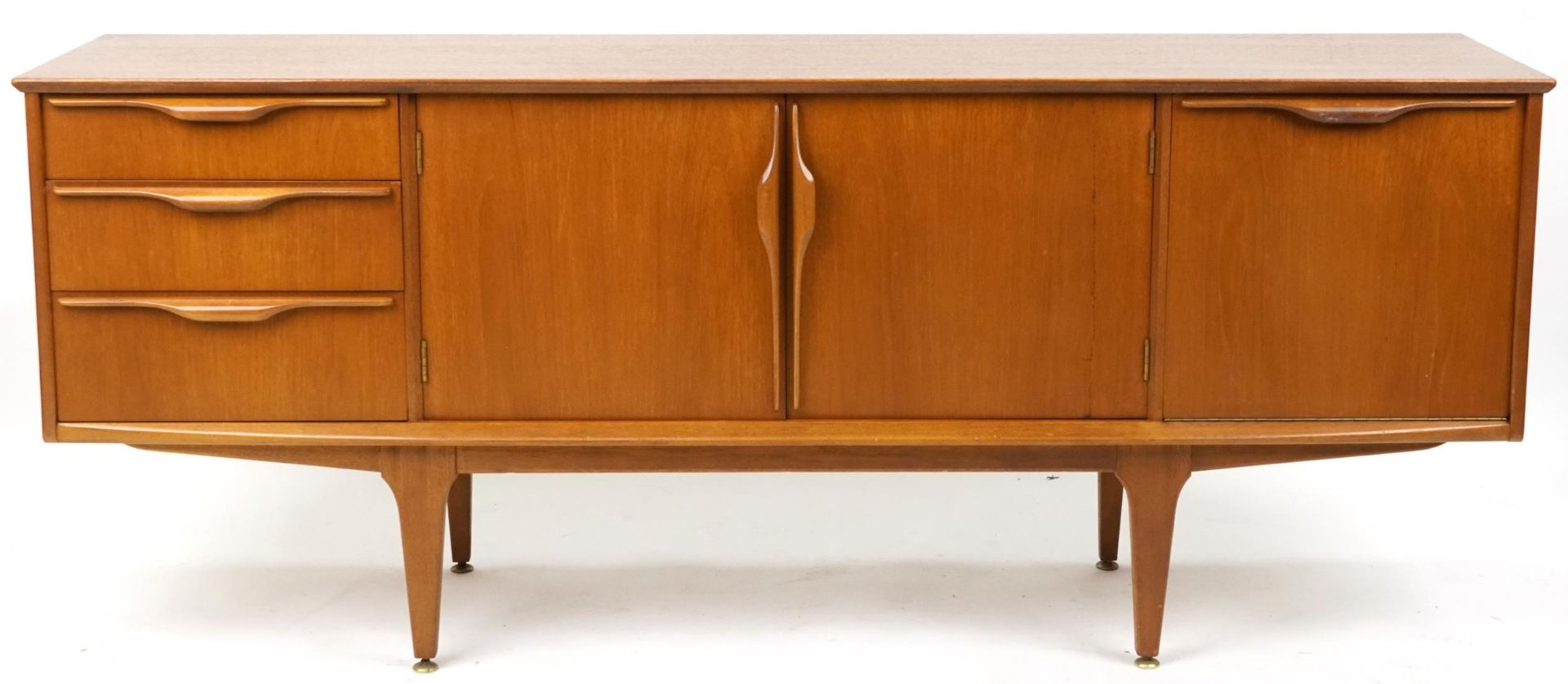 Mackintosh, mid century Scottish teak sideboard fitted with an arrangement of three drawers and