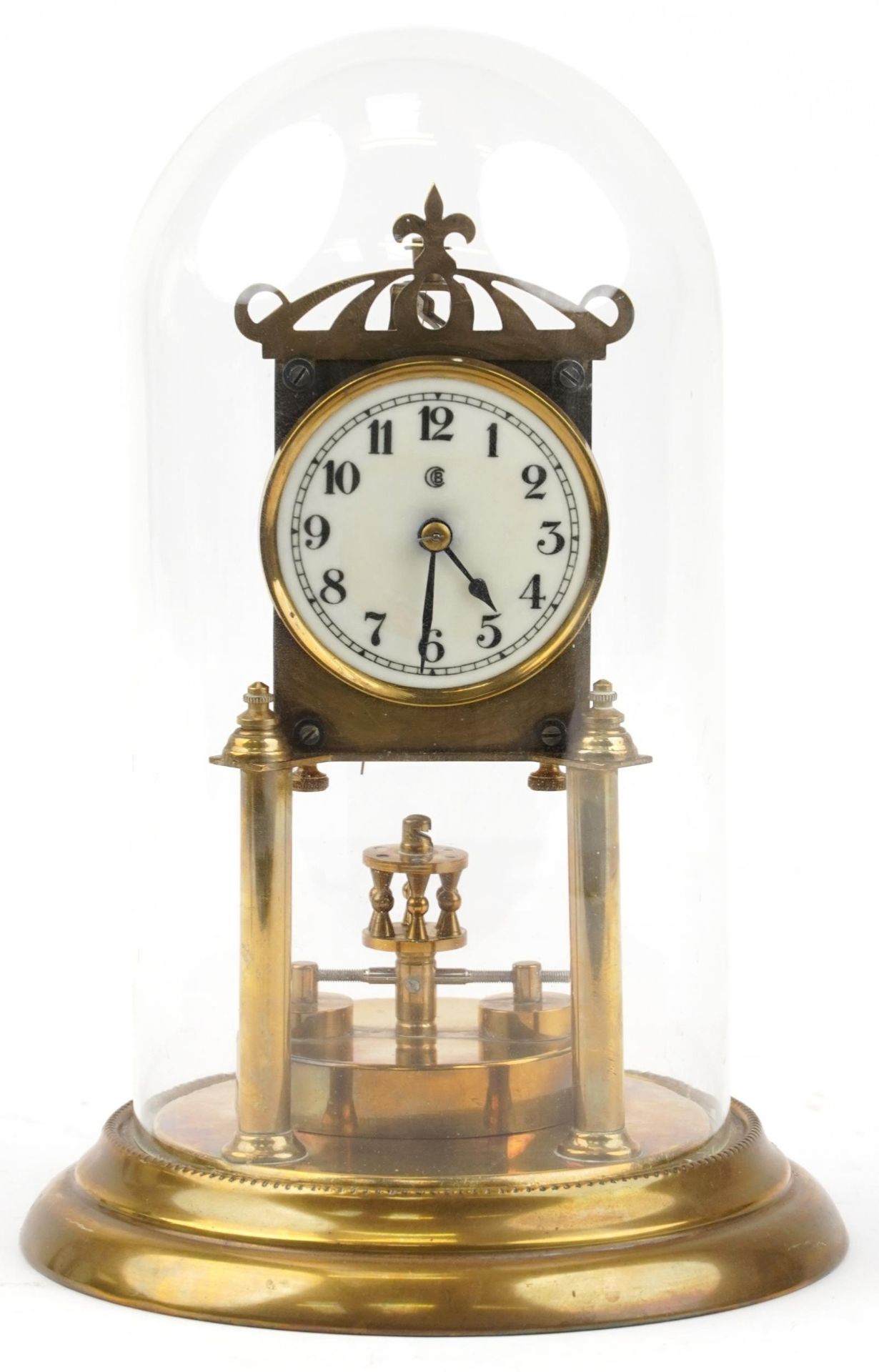 Early 20th century brass anniversary clock with glass dome and enamelled dial having Arabic