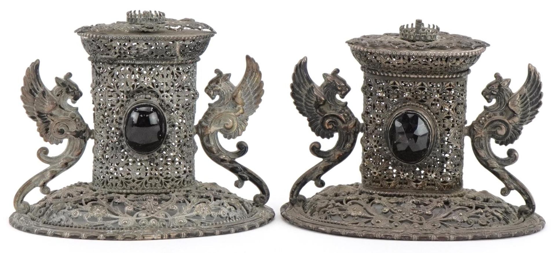 Two of European white metal filigree ornaments with winged dragon handles set with black