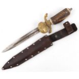 German military interest hunting knife with leather sheath, staghorn handle and steel blade having