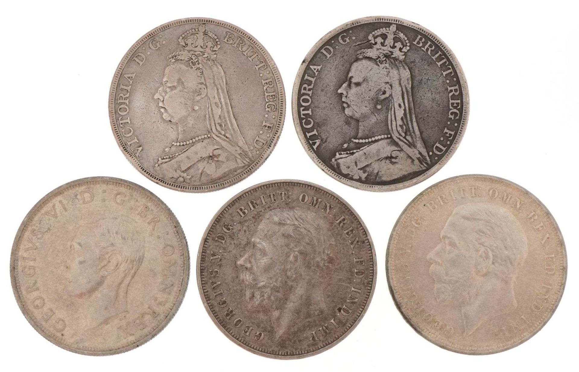 Two Victorian 1889 silver crowns, two George V 1935 silver crowns and a George VI 1937 silver crown